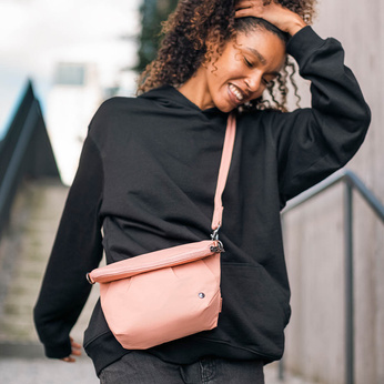 The foldable women's anti-theft handbag Pacsafe Citysafe CX Econyl® - pink